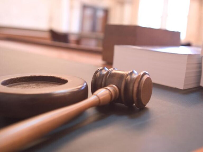 Wooden gavel resting in a Singapore courtroom, symbolising contempt of court and committal proceedings