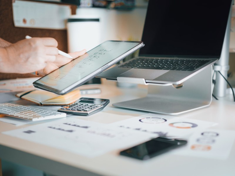 Laptop and calculator on a work desk