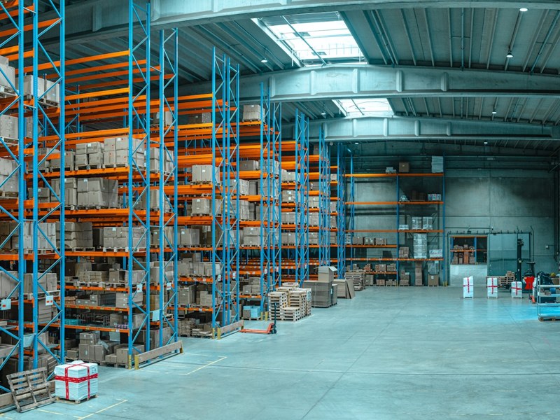 Warehouse shelves with cardboard boxes