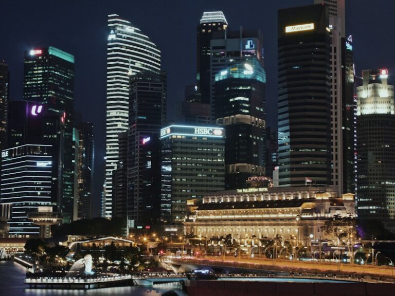Singapore's Central Business District skyline at night, seen across Marina Bay