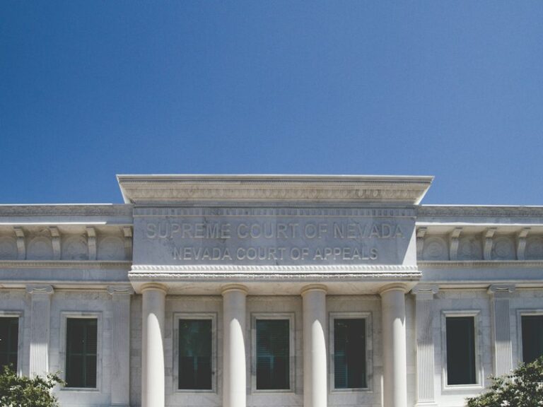 White courthouse building with classical columns