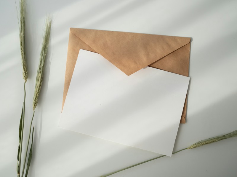 A sheet of white paper resting on a brown envelope, representing a letter of demand