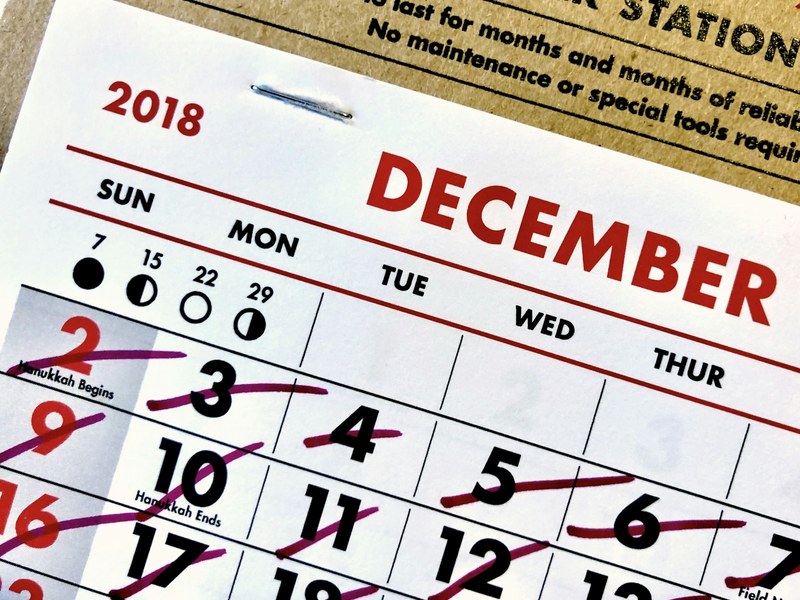 December calendar page with days crossed out, illustrating year-end public holiday payroll planning
