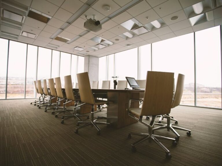 Empty boardroom table where shareholders vote to remove a director of a Singapore company