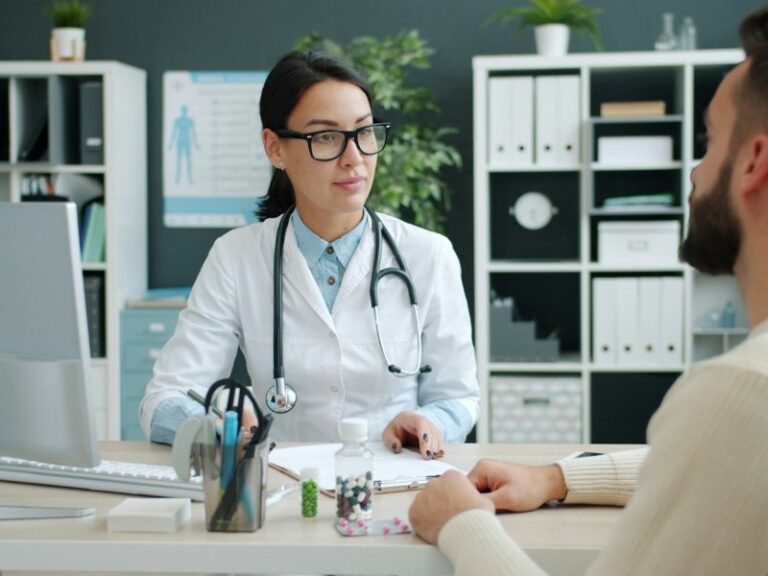 Doctor consulting with a patient in a medical clinic office