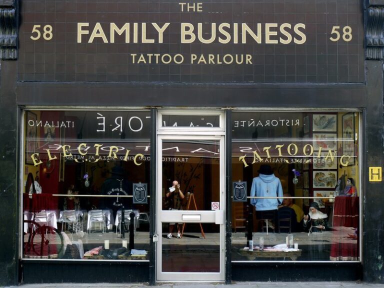 Shopfront with a sign reading The Family Business above the window of a small high-street business